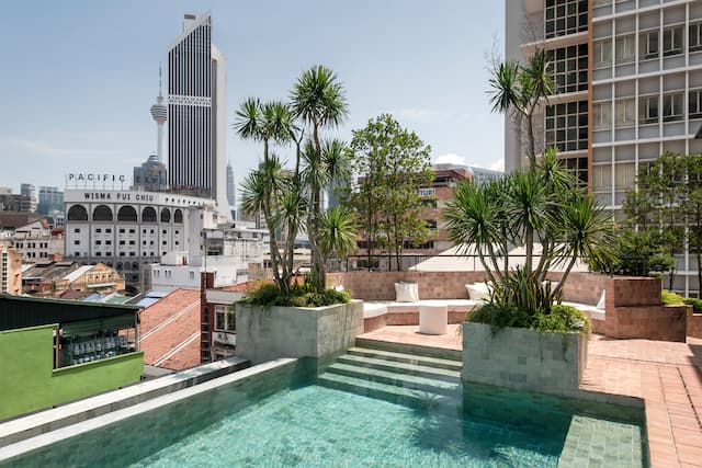 Outdoor Pool Area and Hotel Exterior