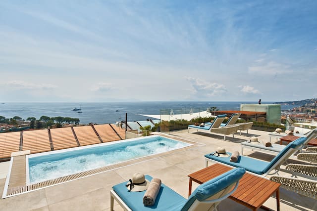 Outdoor pool view with loungers