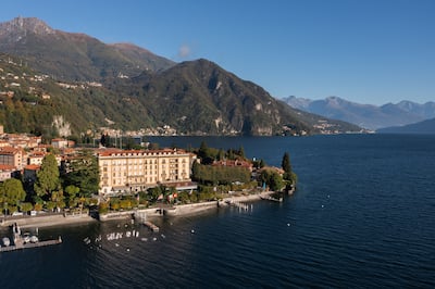 Aerial View of Grand Hotel Victoria by the Water with View of Mountains in Background