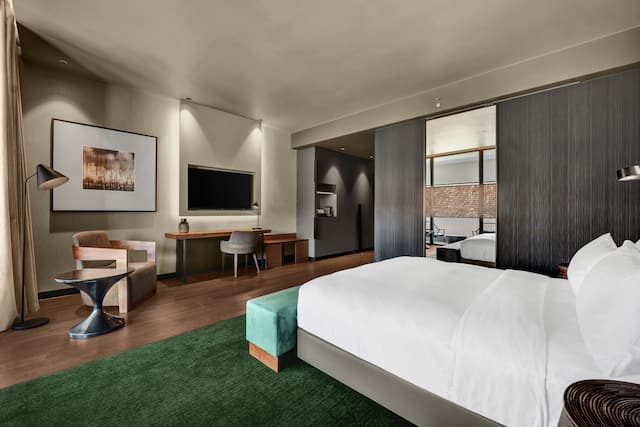 Large Bed, Desk and HDTV in a Guest Room