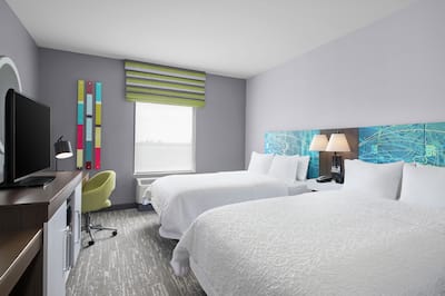 Two Queen Beds, Work Desk, and TV in Guest Room