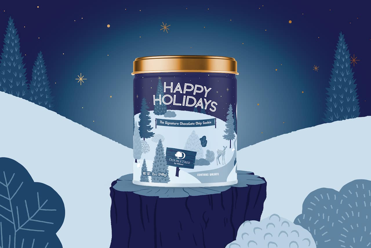 Header: Happy Holidays; Subhead: The Signature Chocolate Chip Cookie; Image of DoubleTree by Hilton Brand logo; Small supporting text: Contains Walnuts