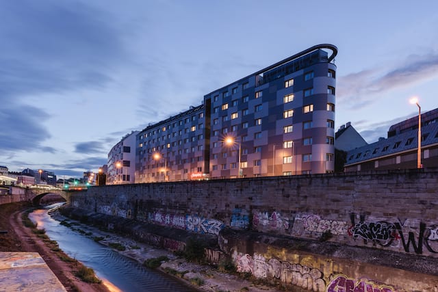 Exterior of the front of the hotel from across the canal.