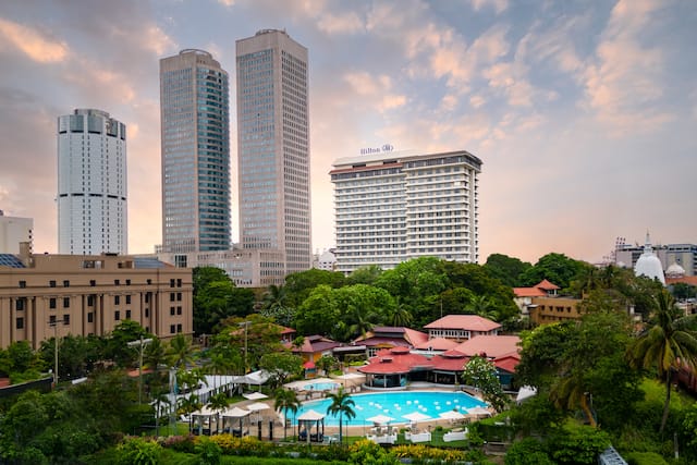 Aerial view of the outdoor pool with the main hotel in the background.