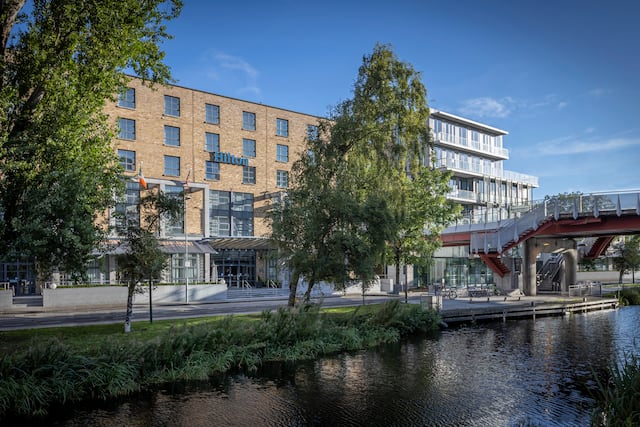 Hotel exterior with river and bridge