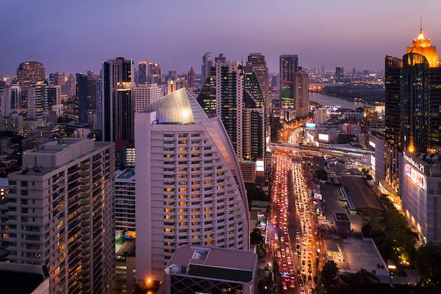 View of Hotel Exterior in a Large City at Night