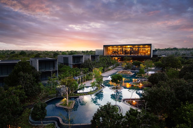 View of Hotel Exterior and Pool Area in the Evening