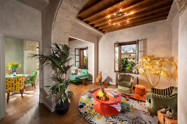 Guestroom lounge area with tables and chairs