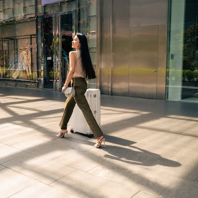 Woman Walking with Luggage