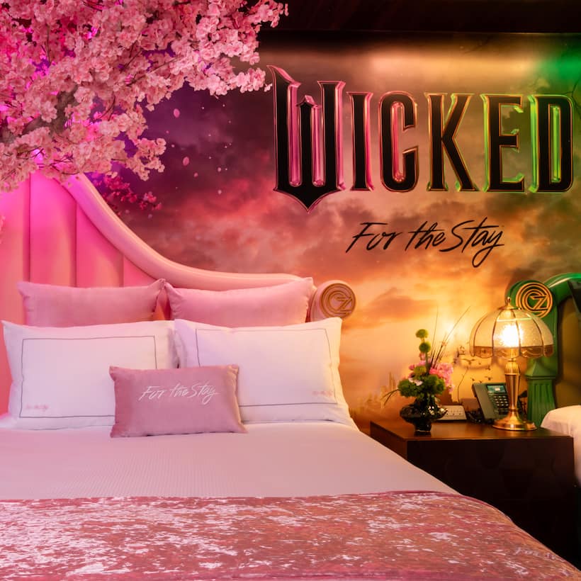 A delightful tribute to the new Wicked film this suite features luxurious pink bedding and a whimsical cherry blossom tree inspired by the film.