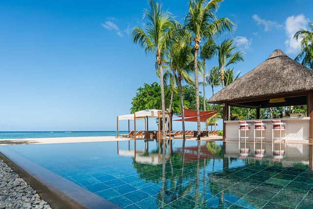 Hibiscus Bar with bar area and stools surrounded by water