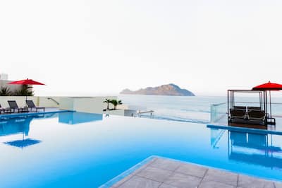 An infinity pool at DoubleTree by Hilton Mazatlan that looks out to the ocean