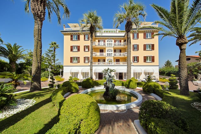 Hotel exterior with garden and fountain