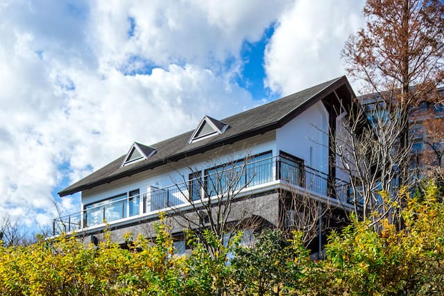 View of Cottage Exterior with Balcony at Daytime