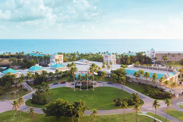Aerial view of the hotel with the ocean in the background.