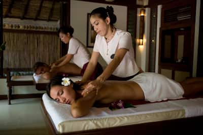 Two people receiving massages