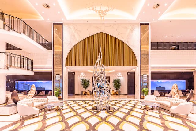 Hotel lobby with comfortable seating and sculpture