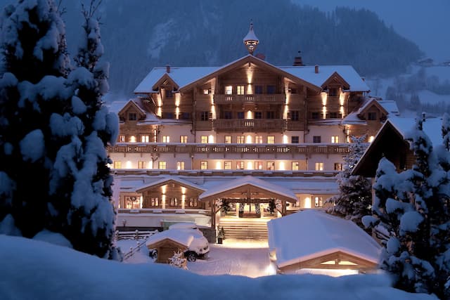 Hotel exterior with entrance in the snow